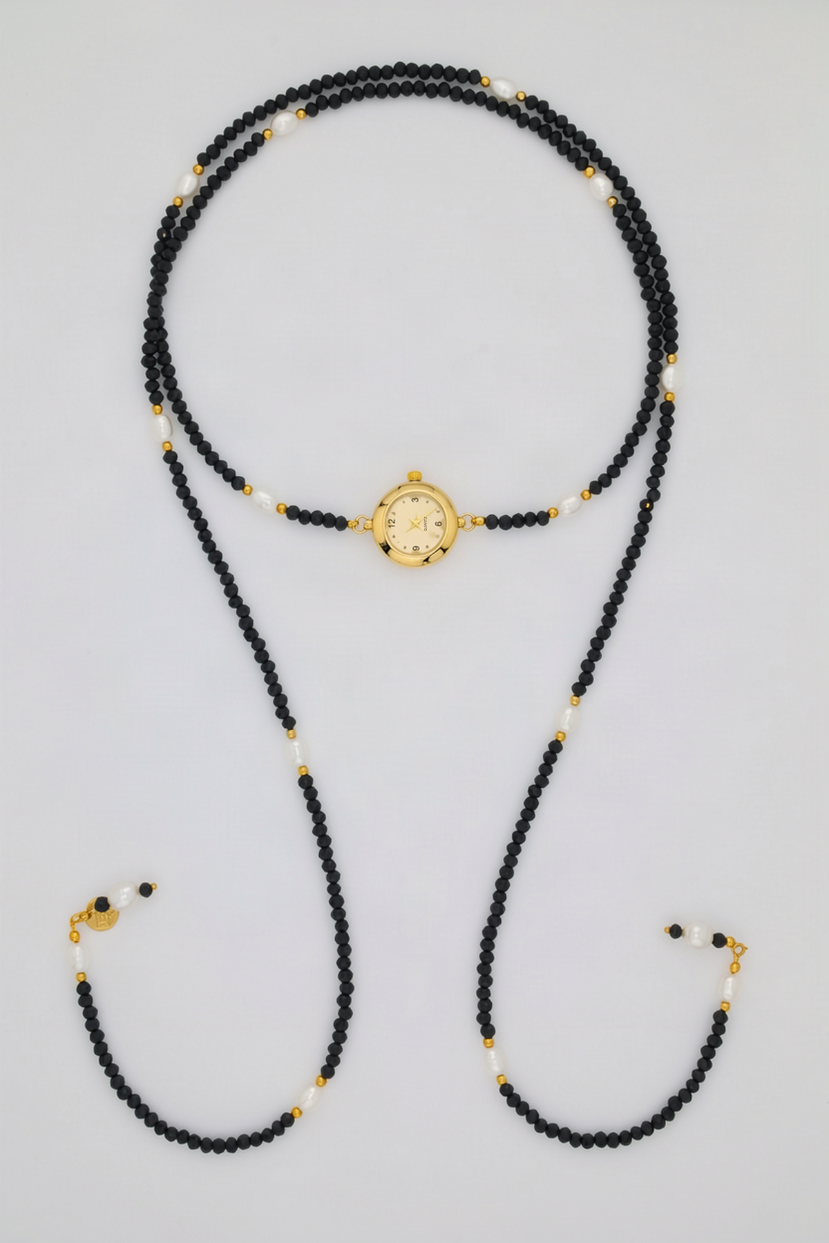 Alba Watch Lariat - Black and Gold with clear quartz watch dial