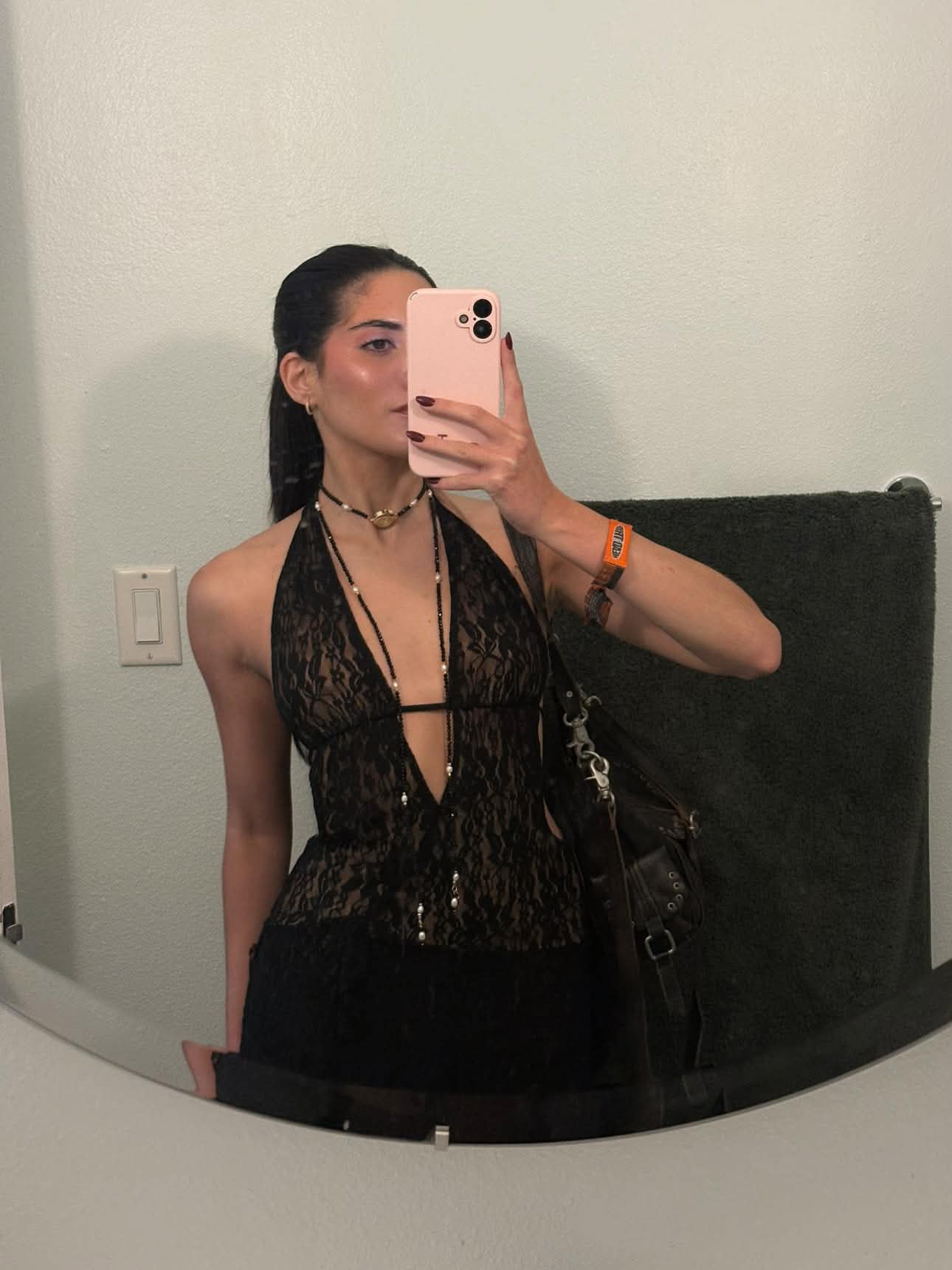 Client wearing the EARTH PLUS FIRE Alba Watch Lariat in black