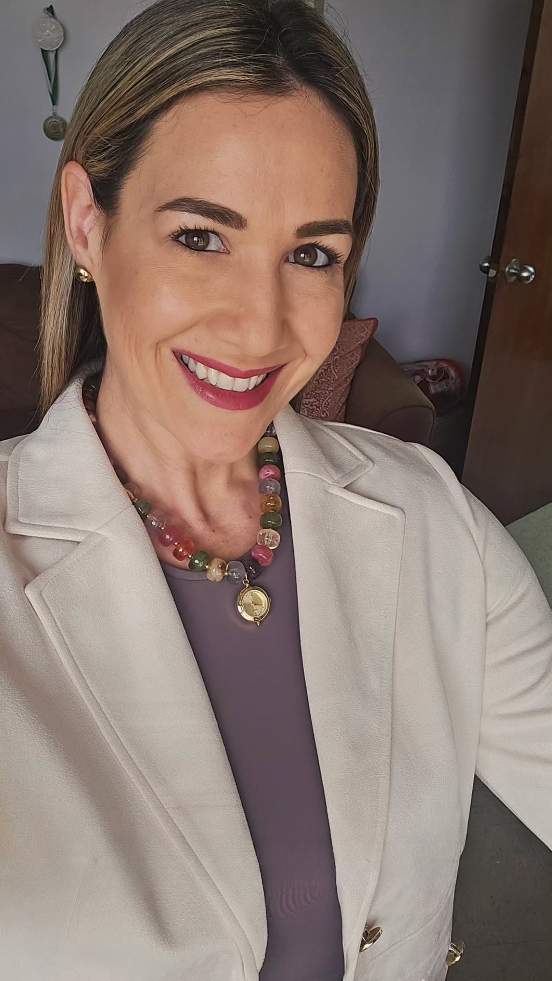 Client styling the EARTH PLUS FIRE Calipso Watch Necklace with a purple top and beige blazer